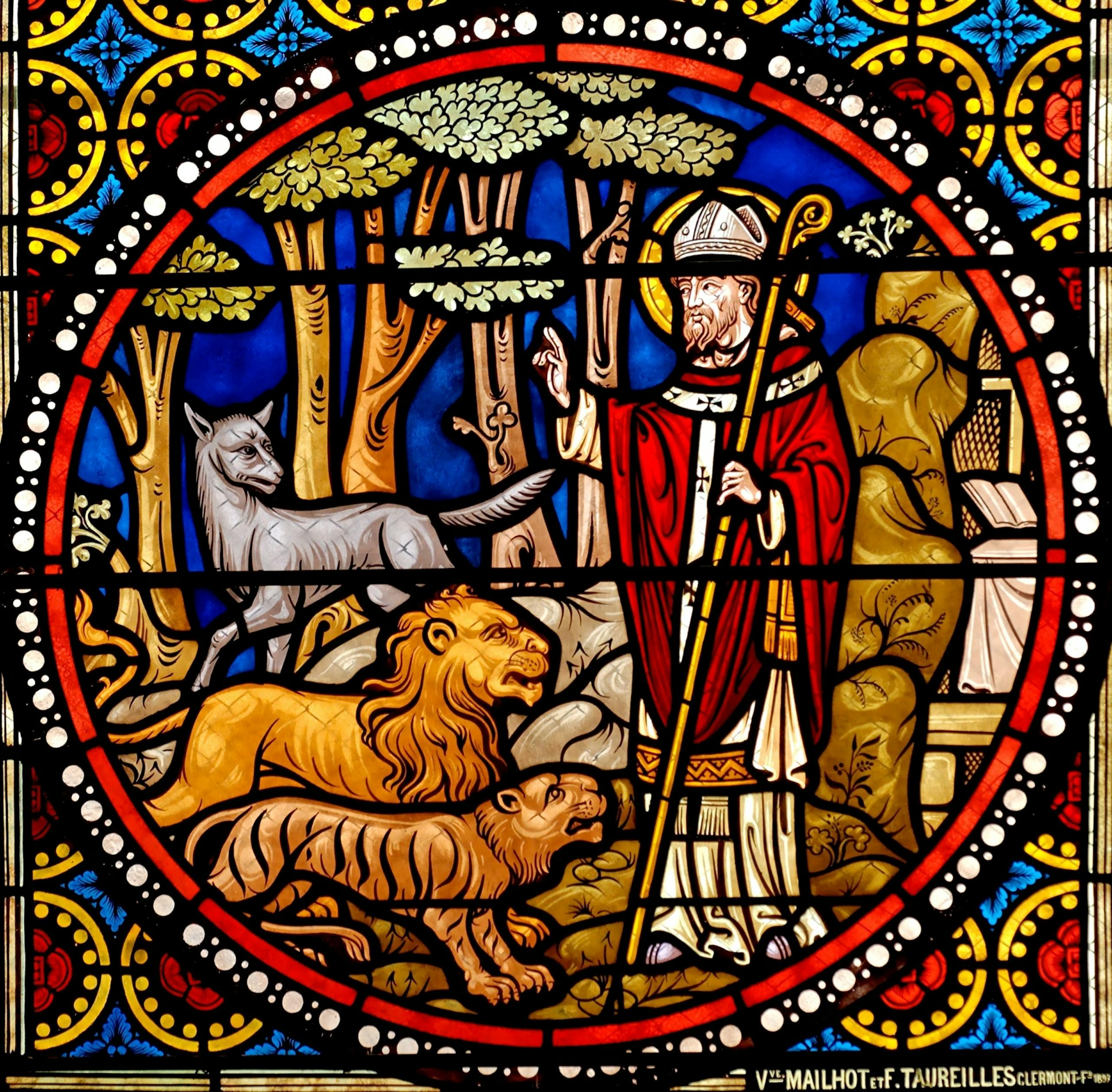Stained glass window of a saint with animals in a church setting, used to symbolise episcopal consecration