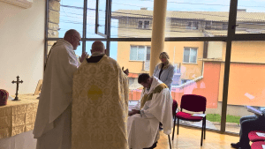 Bishop Ashley Deutschmann seated during the prayer of consecration in Sofia