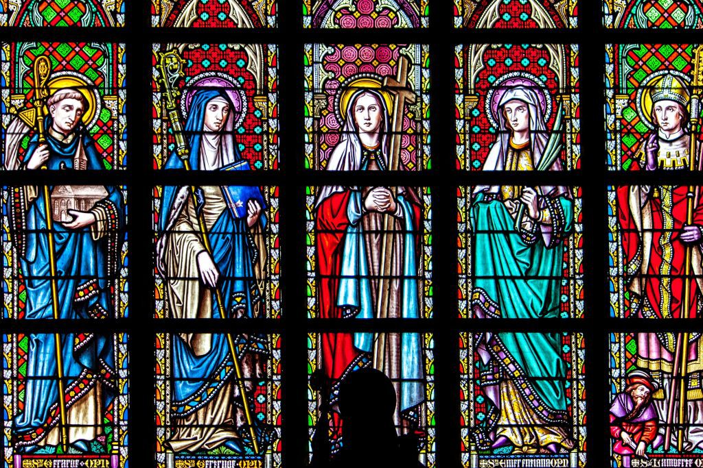 Stained Glass Saints – Apostolic Tradition in Catholic Worship Stained glass window depicting saints and martyrs in traditional Catholic style, reflecting the sacred visual heritage of the apostolic Church